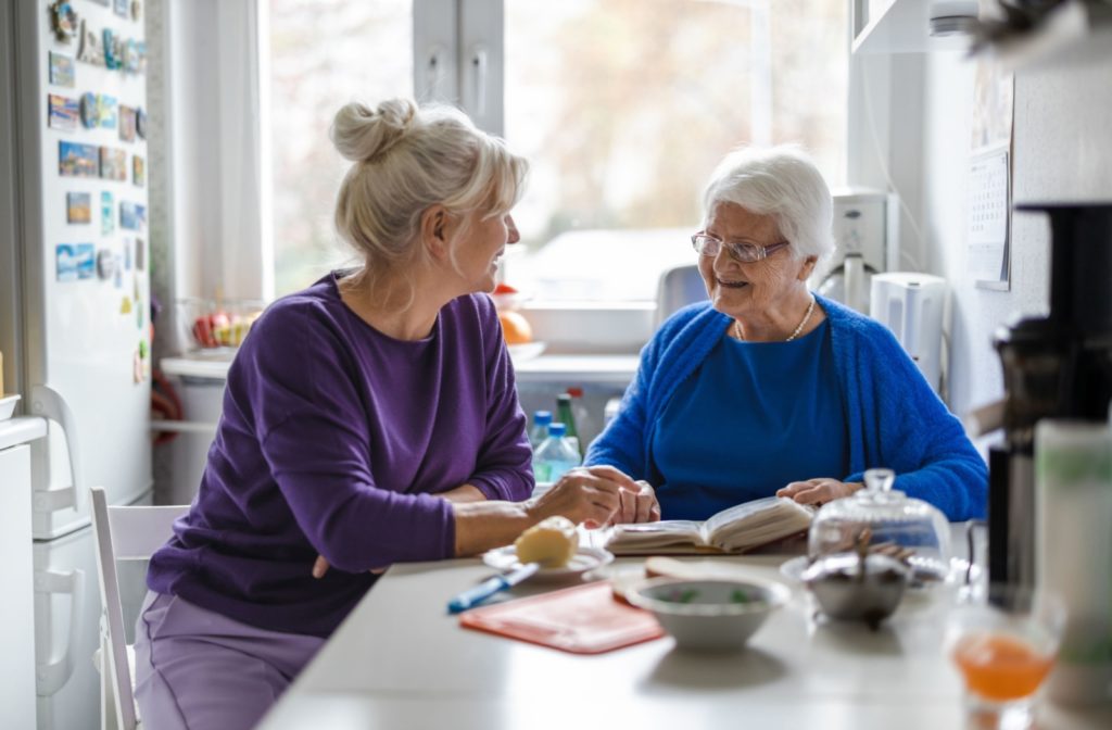 An adult child spending quality time with their parent in memory care.